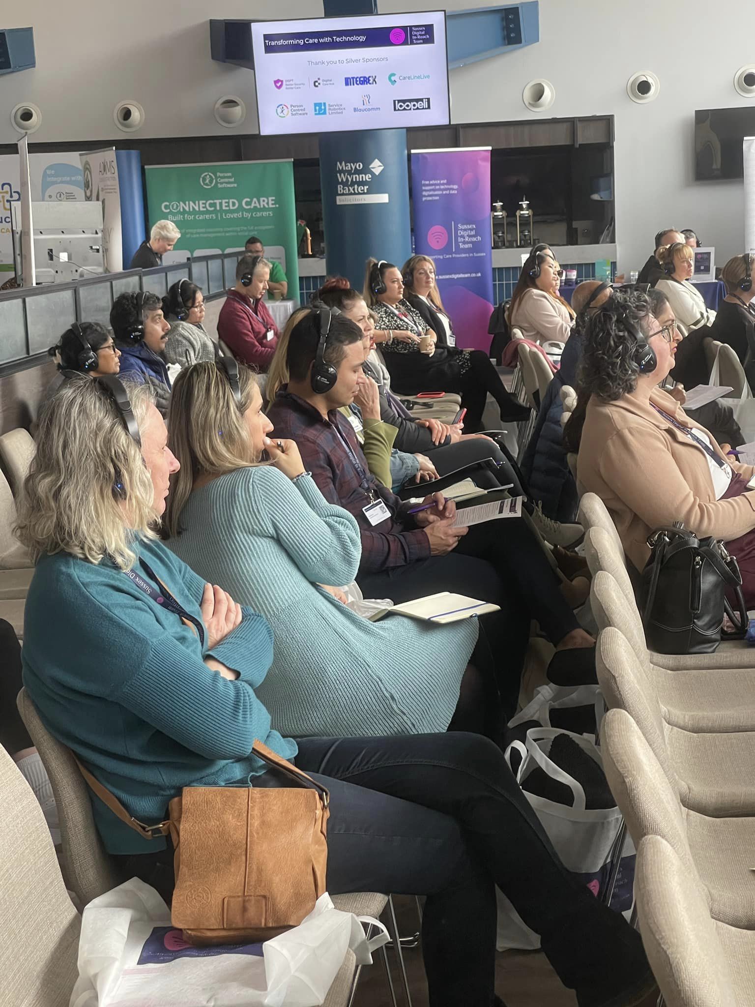 NHS Digital Conference delegates with headphones
