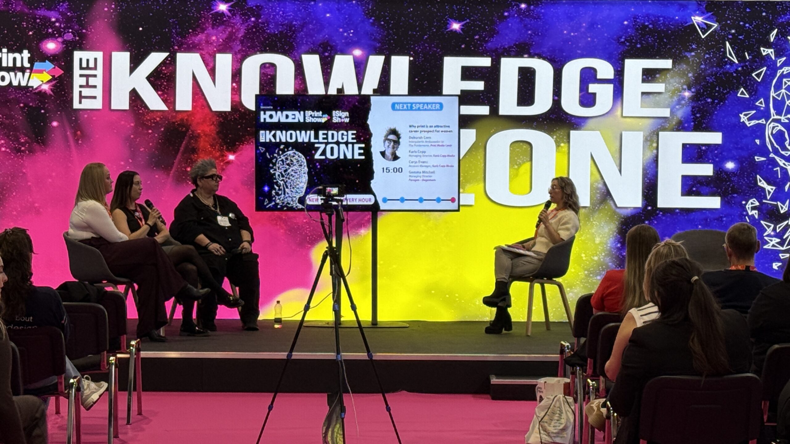 The Knowledge Zone stage at The Print Show, panel discussion in progress with a full audience